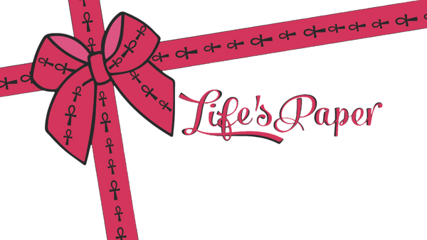 Pink bow tie patterned with small black ankh symbols