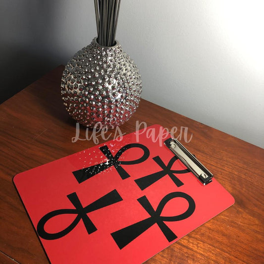 red background with black ankh  image, double sided, 9x12 clipboard