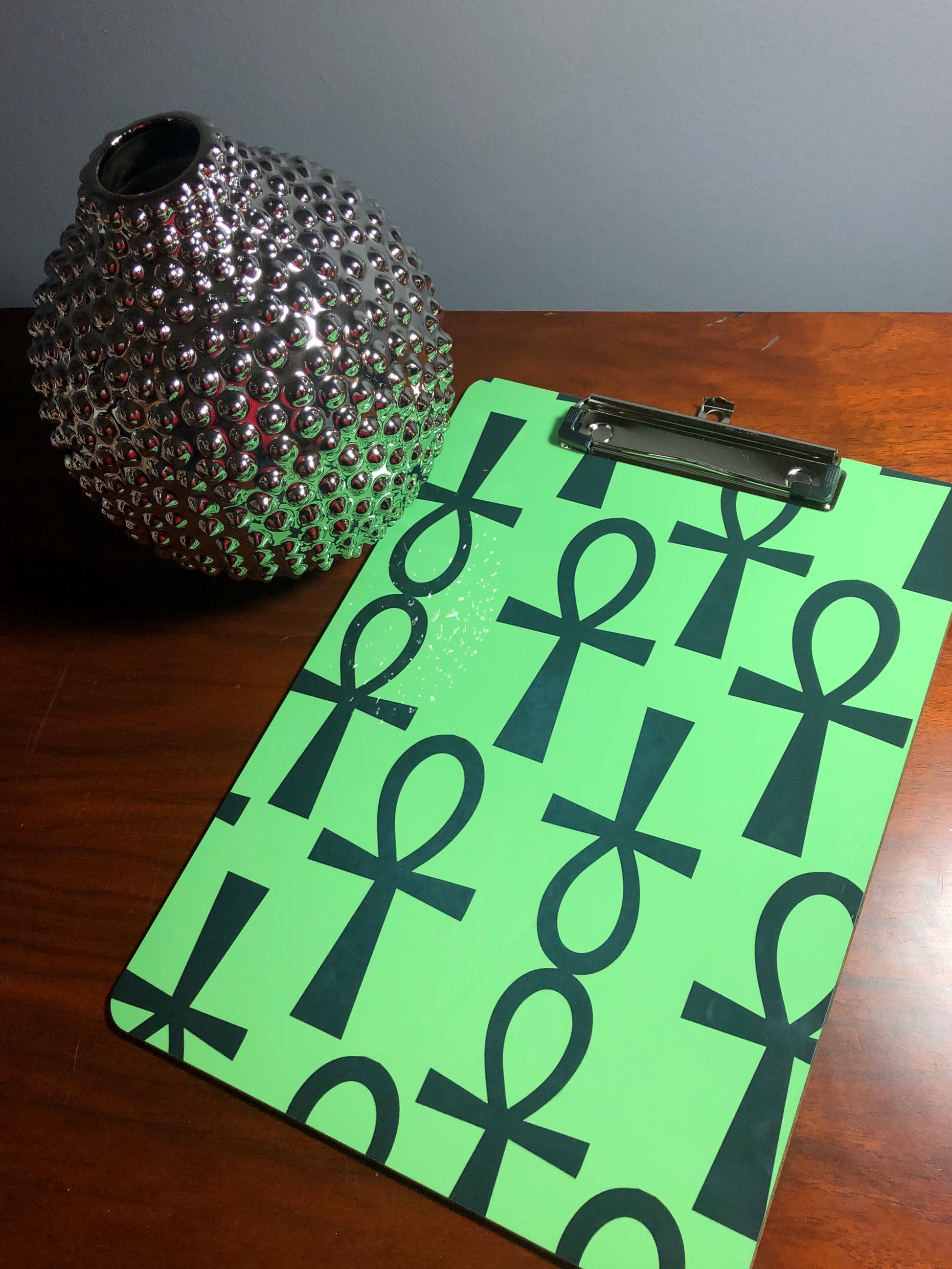 green background with black ankh pattern image, double sided, 9x12 clipboard